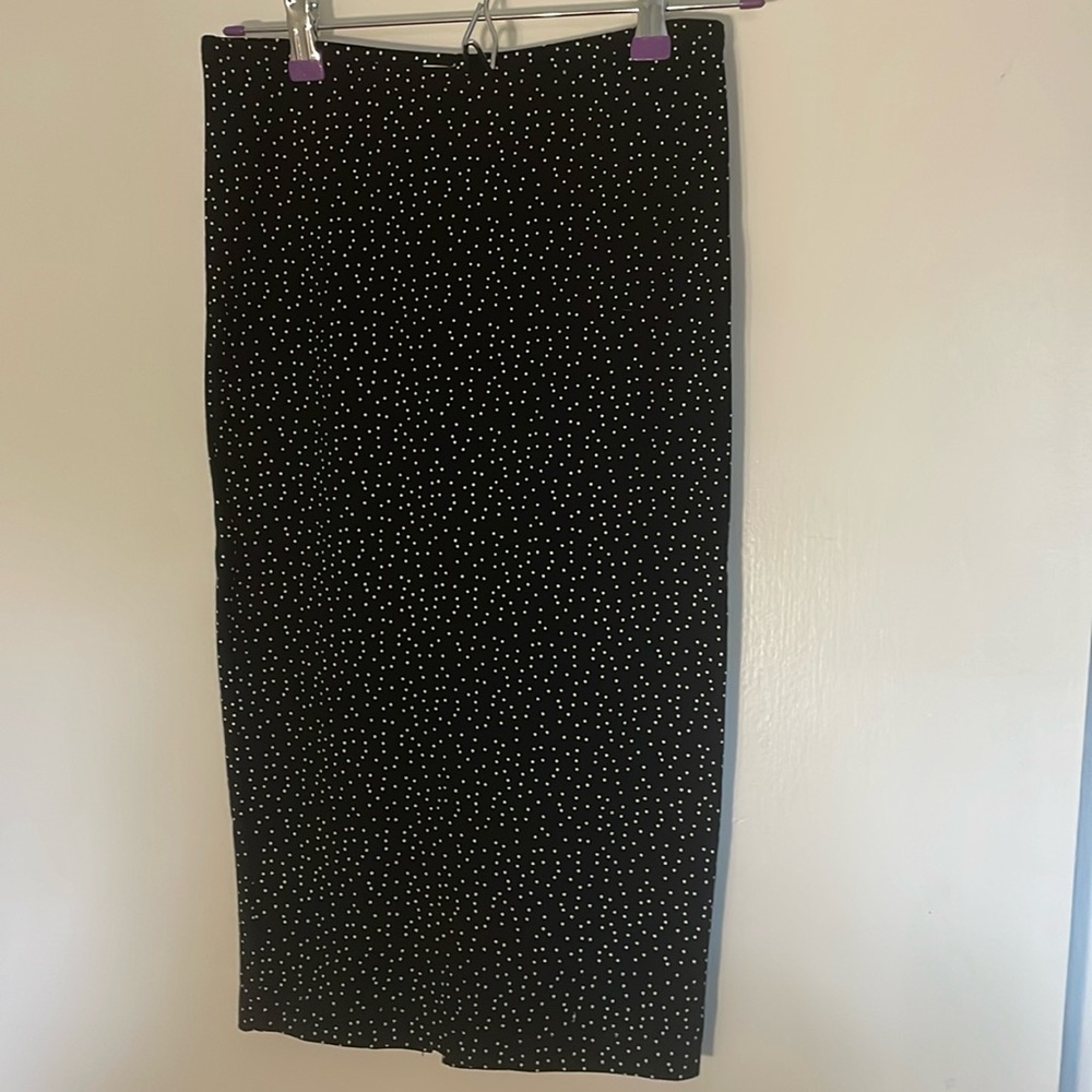 Black, stretchy pencil skirt with tiny white polka dots. XS.